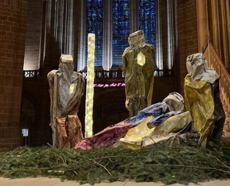 A nativity scene in a cathedral setting.